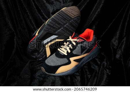Pair of fashion colorful sneaker shoe on a black isolated background
Fitness sneakers shoes for training, running shoe. Sport shoes.
Fashion black sneaker, daddy shoe, ugly shoe, street fashion.