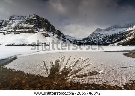 Bow Lake is a small lake in Banff national park, Canada. A chunk of ice hit the surface of the lake.