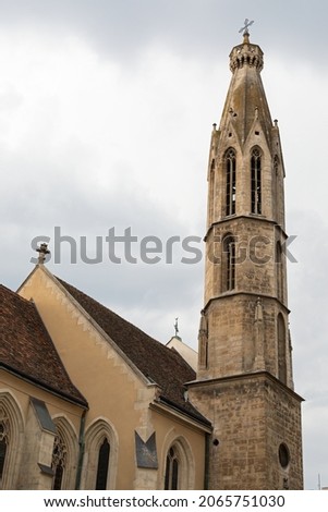 Picture of religious building tower against cloudy sky in Sopron, Hungary