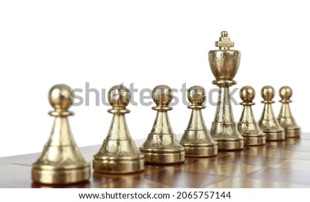 King among pawns on wooden chess board against white background