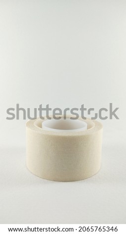 Isolated white paper masking tape placed on a white background. v2