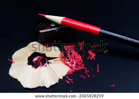 Pencil and pencil sharperner colour pencil photo in wooden background 