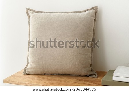 Beige cushion home decor, on a bench Royalty-Free Stock Photo #2065844975