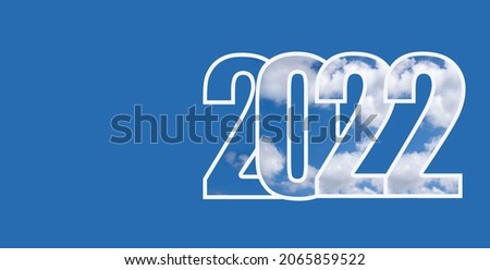 Happy New Year 2022. Numbers 2022 with texture of white cloud on an isolated blue background. Concept of welcome to new year.
