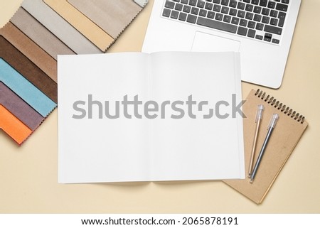 Fabric samples and blank magazine on light background