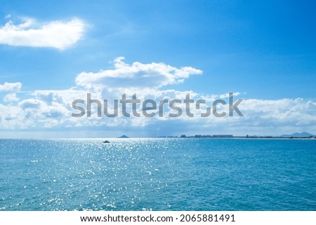 Nice seascape with boats going through the surf in vacation time Royalty-Free Stock Photo #2065881491