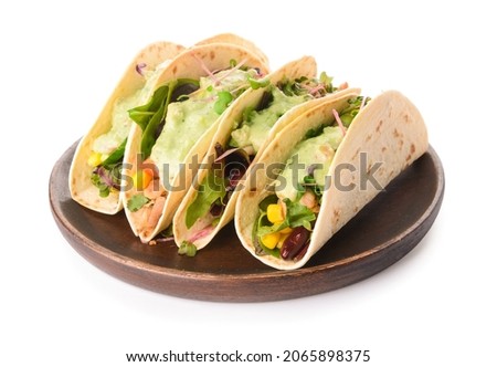 Plate with tacos and tasty guacamole on white background