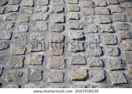 Texture of paving stones. Cobblestones with cement in the middle. Cobblestone wall. Cobblestone floor. Texture for matte painting.