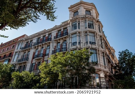 Exterior view of historical buildings in Madrid, Spain, Europe. Colorful Mediterranean street characterized by elegance, discreet exclusivity, and total tranquillity in the classic Retiro neighborhood Royalty-Free Stock Photo #2065921952