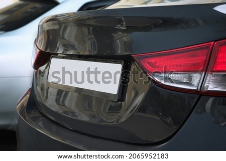 Closeup view of modern car with license plate outdoors
