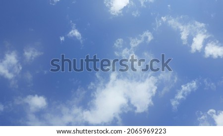Abstract white clouds on a light blue sky in the afternoon