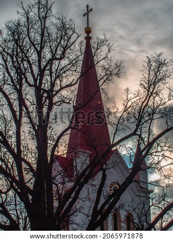 Cesis St. John Evangelical Lutheran Church on a dark autumn evening. High contrast HDR photo image, artistic graininess of the image. 