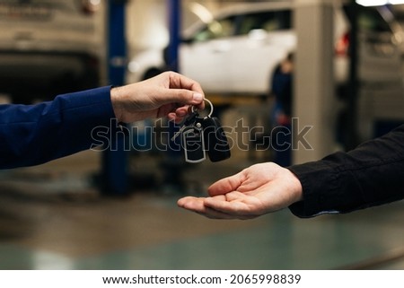 Car key handover, a transport ownership or leasing concept