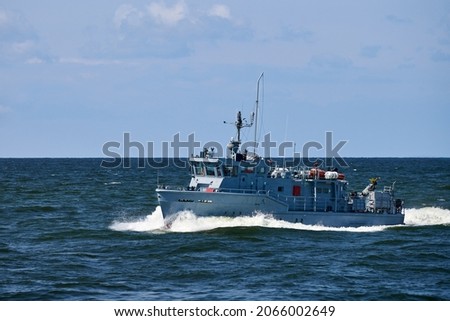 Coastguard, rescue and support patrol boat for defense sailing in blue sea. Navy patrol vessel protecting water borders and fisheries. Military ship, warship, battleship. Baltic Fleet, Russian Navy Royalty-Free Stock Photo #2066002649