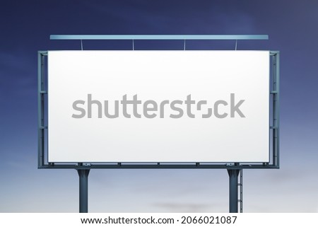 Blank white horizontal billboard on blue sky background at night, front view. Mock up, advertising concept