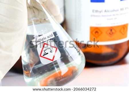 sulfuric acid in glass, chemical in the laboratory and industry Royalty-Free Stock Photo #2066034272
