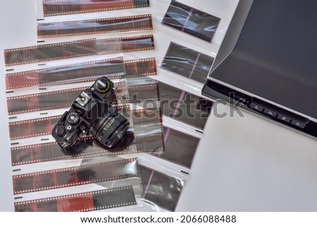 Film photography and scanning photo negatives using a scanner. Film camera with films negative various formats and scanner for scanning and digitizing analog images.