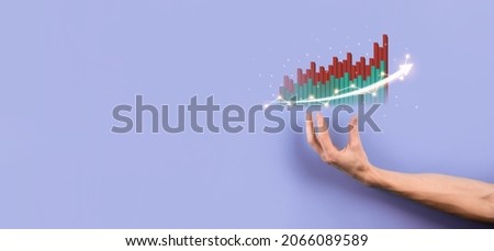 Male hand holding graph icon.checking analyzing sales data growth graph chart and stock market on global networking. Business strategy, planning and digital marketing.