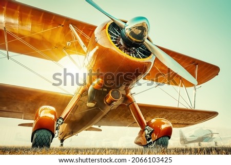 historical aircraft against a sunset Royalty-Free Stock Photo #2066103425