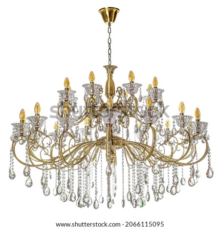 Gold tone chandelier on a white background. Chandelier for apartment decor Royalty-Free Stock Photo #2066115095