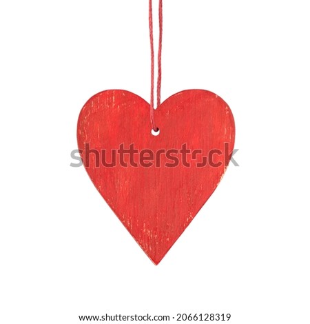 Hanging red wooden heart. Christmas ornament isolated on a white background.