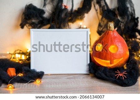 Halloween holiday concept. Photo frame, halloween decorations on white background. Front view, copy space . High quality photo