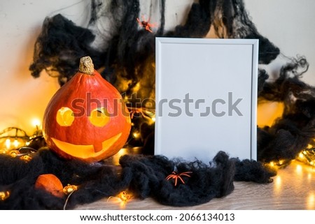Halloween holiday concept. Photo frame, halloween decorations on white background. Front view, copy space . High quality photo