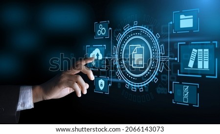 Business hand clicks virtual screen to document management, online documentation database and digital file storage system software, records keeping, database technology, file access, doc sharing. Royalty-Free Stock Photo #2066143073