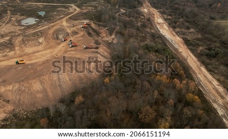Construction site in a city vacant lot. Photographed in cloudy weather. Aerial photography. Royalty-Free Stock Photo #2066151194