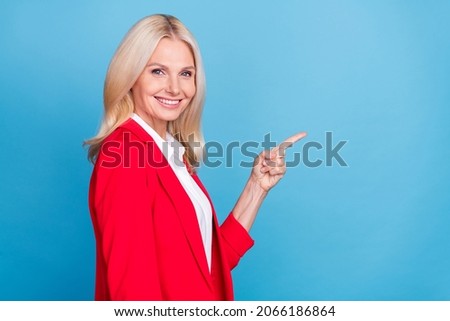 Profile side photo of retired woman indicate finger empty space advise choose recommend isolated over blue color background