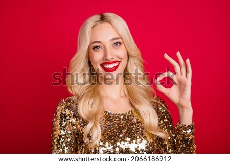 Photo of young woman happy positive smile show okay alright recommend feedback sign isolated over red color background