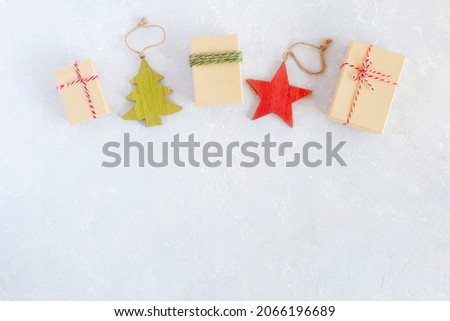 Christmas composition made of gift boxes and wooden decoration, top view, copy space
