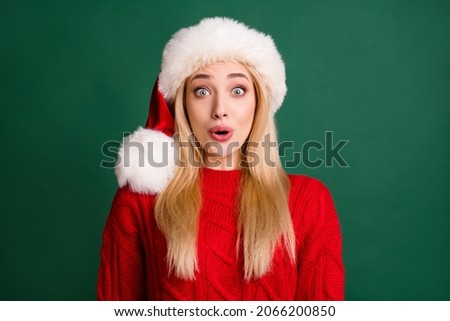 Portrait of attractive cheerful amazed girl festal day eve reaction isolated over green color background