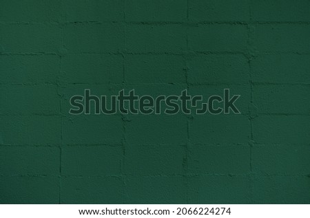 Old painted concrete block wall background. Stylish concrete block texture backdrop.	