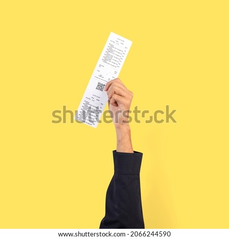 Hand holding receipt for shopping campaign Royalty-Free Stock Photo #2066244590