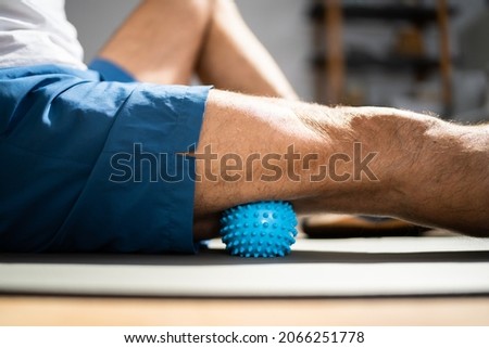 Leg Massage With Trigger Point Spiky Massage Ball. Myofascial Release Royalty-Free Stock Photo #2066251778