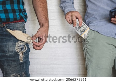 A businessman with money in his pocket and a poor worker with an empty pocket. The concept of income inequality of the population. Social stratification Royalty-Free Stock Photo #2066273861