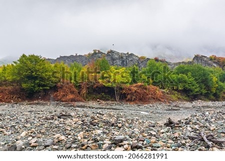 Mountain river bed in autumn season Royalty-Free Stock Photo #2066281991
