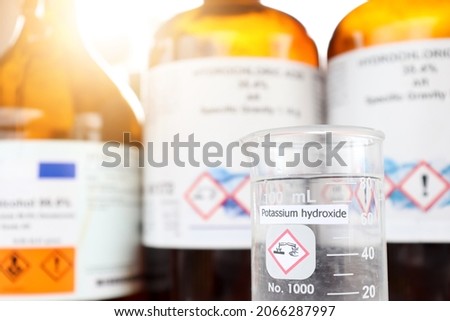 Potassium hydroxide liquid in glass, chemical in the laboratory and industry Royalty-Free Stock Photo #2066287997