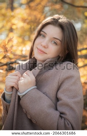 Portrait of a thoughtful and sad girl. Autumn colors . Lifestyle. Autumn mood. Forest