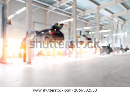Blurred no focus background repair car service with sun light for copy space. Royalty-Free Stock Photo #2066302553