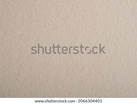 Beige textured paper background. Pastel marble decorative surface.
