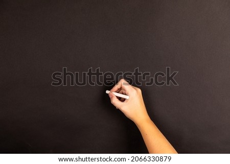 hand writing on a chalkboard
