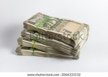Stack of five hundred Indian rupee notes in white background. Huge cash in Indian currency notes. Royalty-Free Stock Photo #2066333132