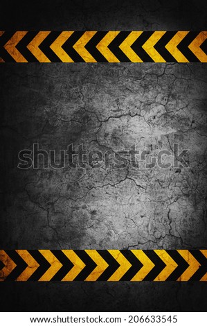 Asphalt background with black and yellow markings, top view
