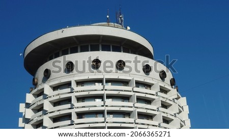 The facade of an old Soviet building in the style of modernism. The building is in the style of modernism. Soviet modernism. Fragment of the facade of the Soviet modernist building Royalty-Free Stock Photo #2066365271