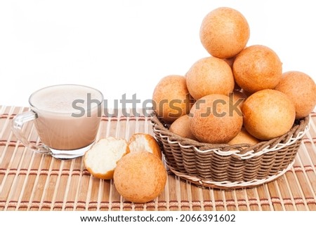 Buñuelos traditional Colombian food; Fried Cheese Bread And Hot Chocolate Drink, Photo On White Background