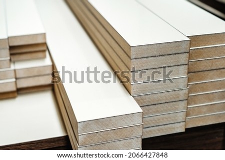 Chipboard furniture parts prepared for edgebanding. Close-up Royalty-Free Stock Photo #2066427848