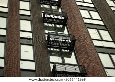 Windows in the building. Air conditioners are not installed in the grid. Multi-storey house.