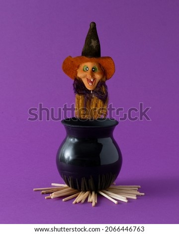 Witch placed in a cauldron to boil.